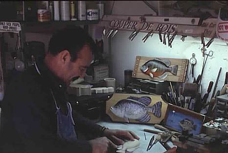 C.J. Knobloch of Thibodaux carves a fish in his workshop.